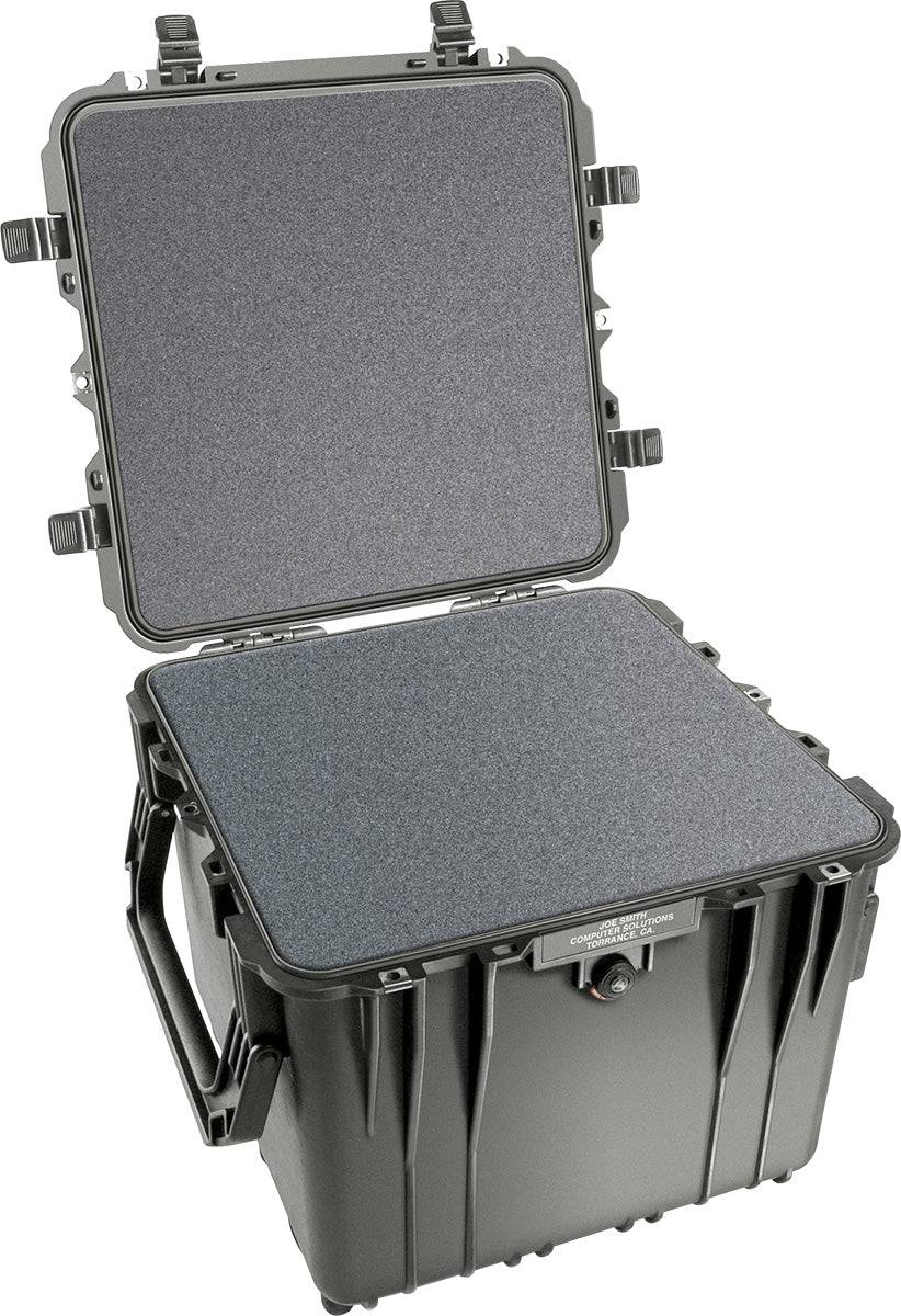 The PELI 0340 Protector Cube Case is a black hard plastic case with a hinged, open lid, foam-lined interior, and side handle, providing trusted watertight and crushproof protection.