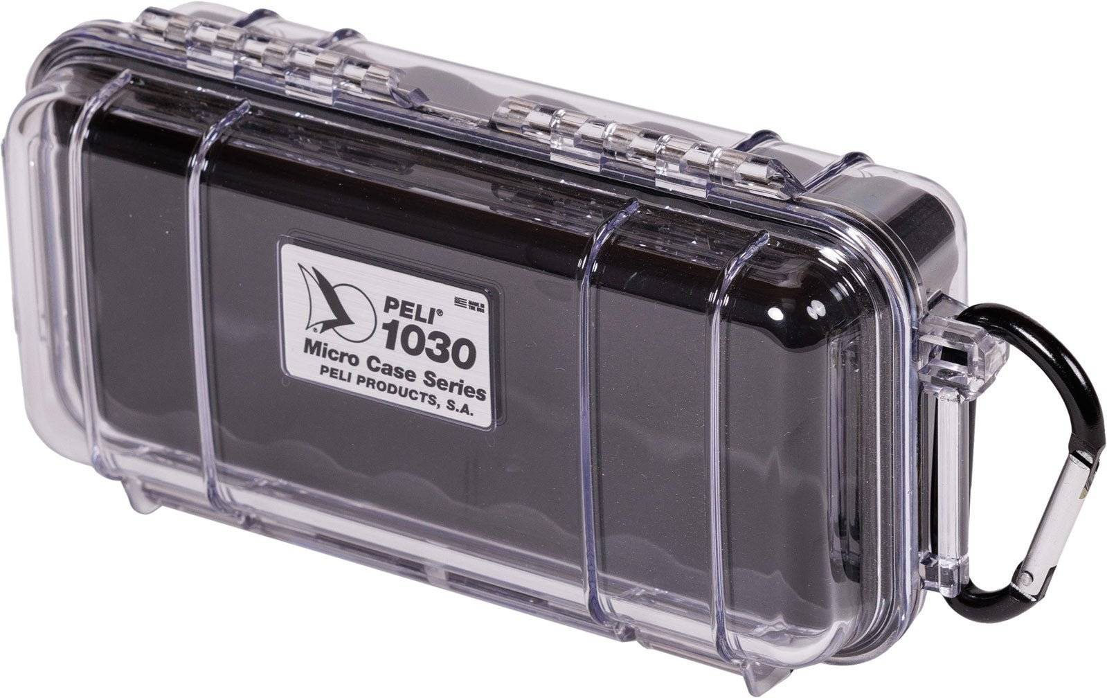 The 1030 PELI Micro™ Case is a clear hard plastic case with a black liner and metal carabiner, offering crushproof protection for your valuables on the go.
