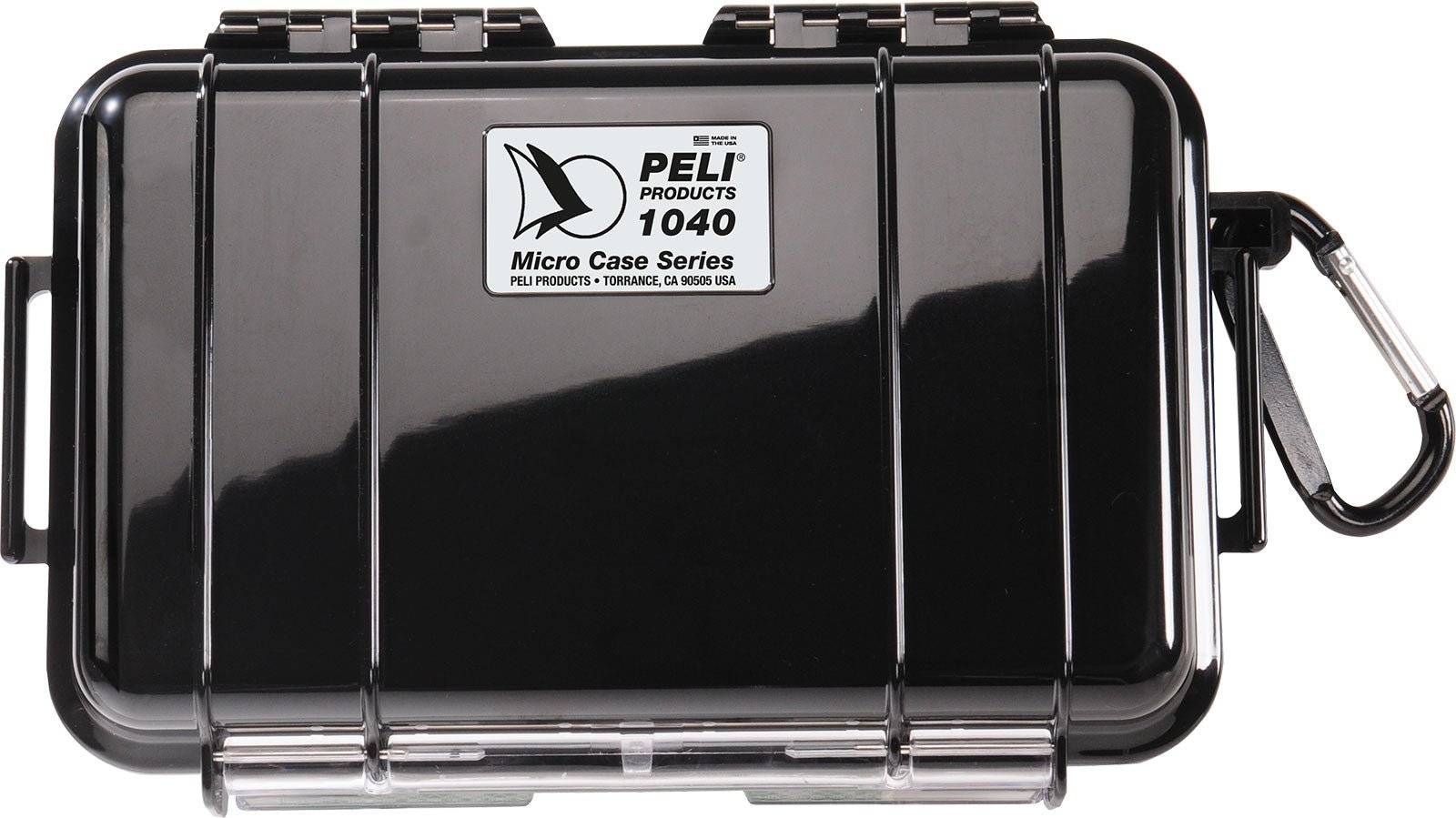 The 1040 PELI Micro™ Case is shown closed from above with a carabiner and lid label—this dustproof case protects your valuables reliably.