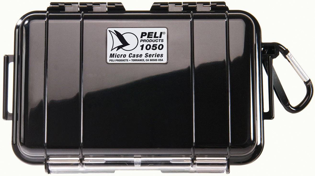 The black 1050 PELI Micro™ Case is crushproof and watertight, featuring a hinged lid, secure latch, attached carabiner, and visible branding with model info on top.