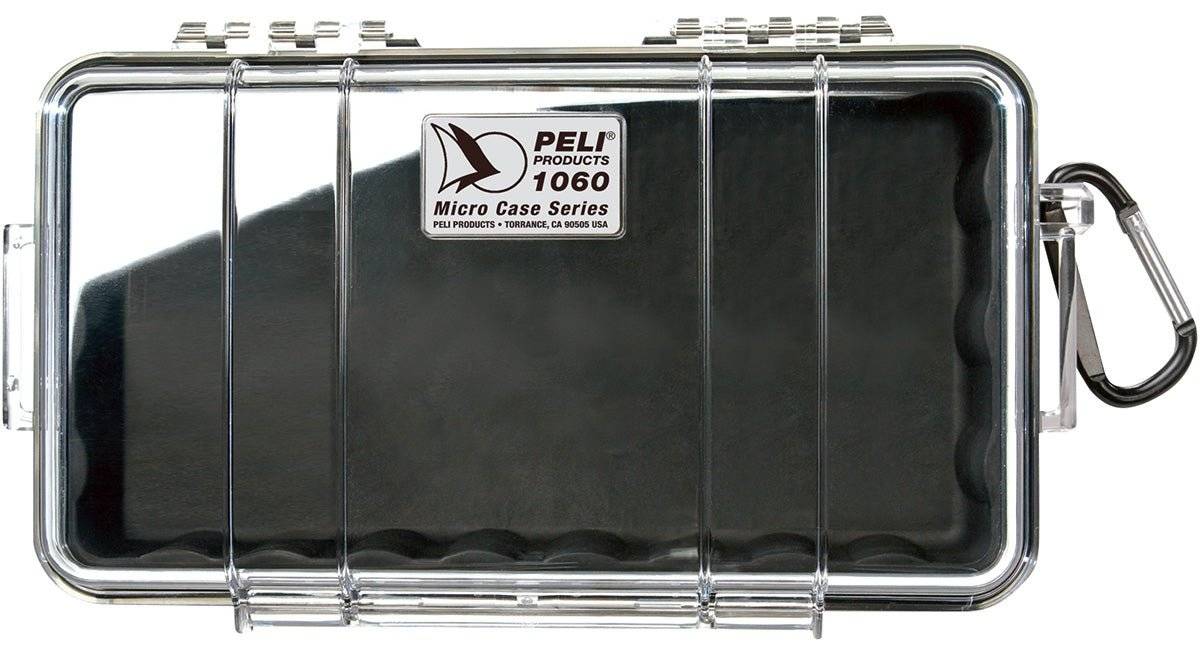 The 1060 PELI Micro™ Case is a clear, hard plastic case with a black interior, metal latch, and carabiner. Crushproof and secure, it keeps your valuables protected.