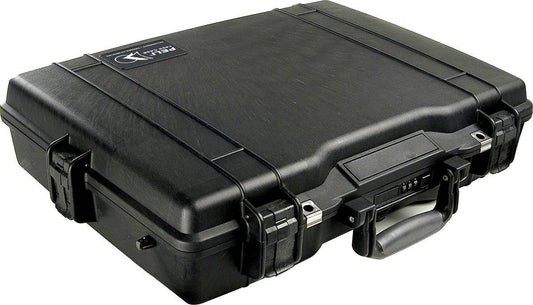 A closed black PELI 1495 Protector Laptop Case with a handle and secure latches sits on a plain surface. This crushproof case offers maximum protection.