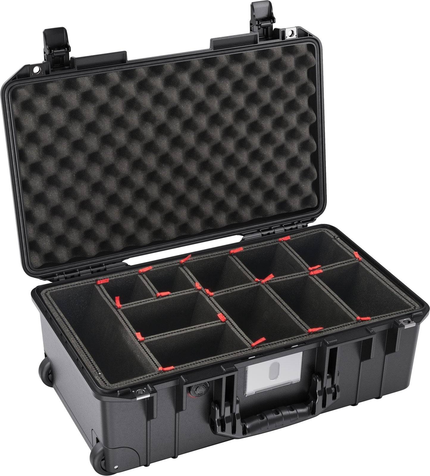 The 1535 Air Case is a black hard-shell carrying case with foam padding in the lid and multiple adjustable interior compartments, providing lightweight protection and reliable organization.