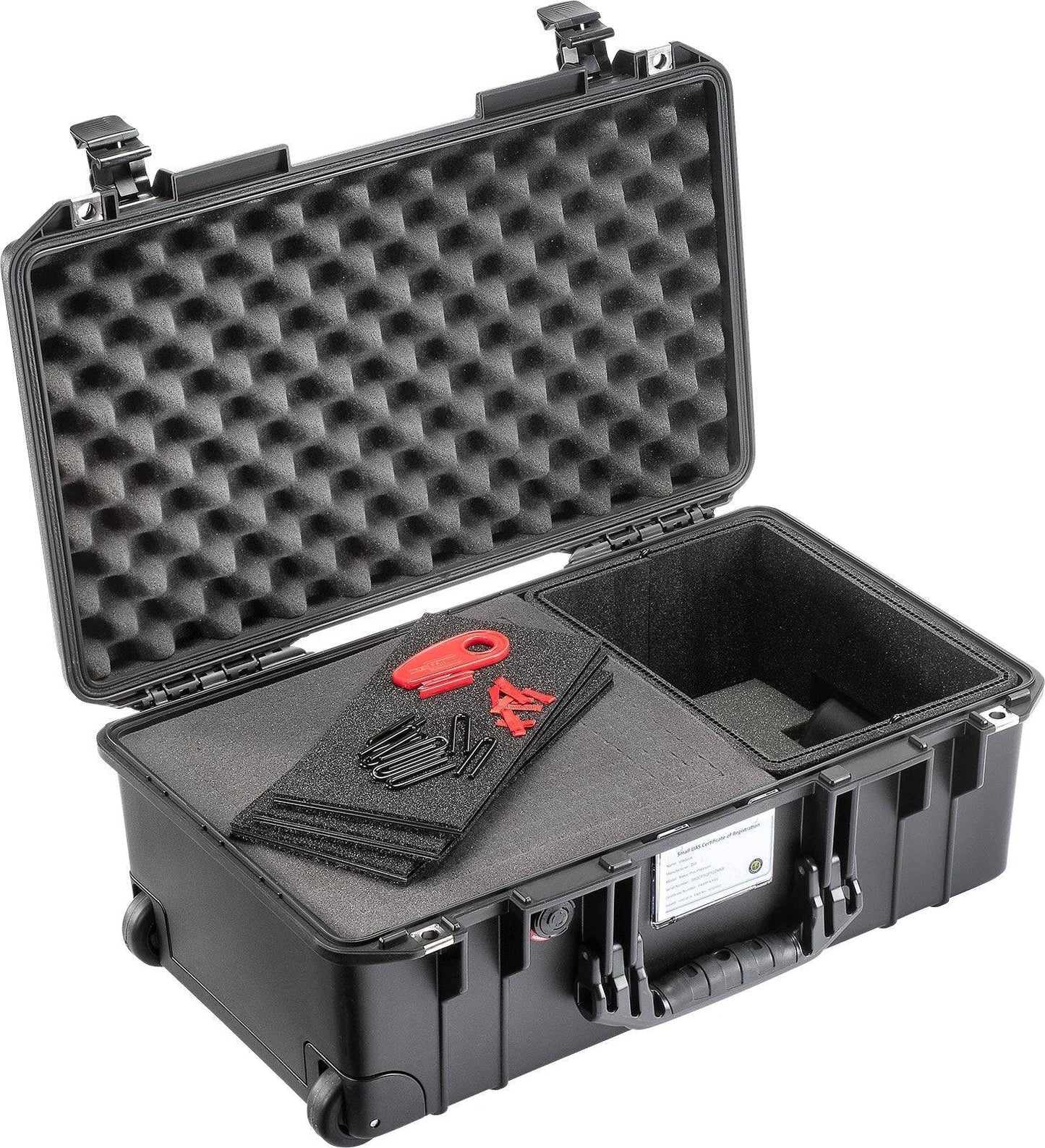 The 1535 Air Case is a lightweight black protective case with a hard shell, foam padding, and an open lid, designed to hold assorted small tools and materials.