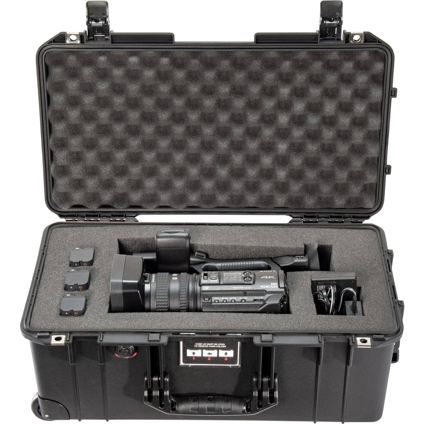 A black 1556 Air Case securely holds a video camera; it’s a waterproof protective case from the PELI Air Long/Deep Series.