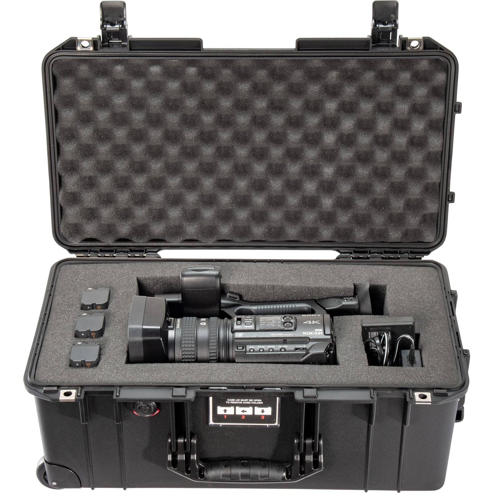 A black 1556 Air Case securely holds a video camera; it’s a waterproof protective case from the PELI Air Long/Deep Series.
