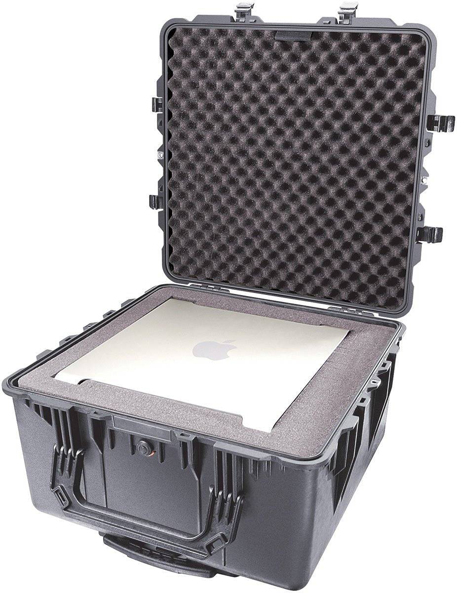 The Black 1640 Protector Transport Case with foam padding is shown open, securely holding a laptop with an Apple logo inside.