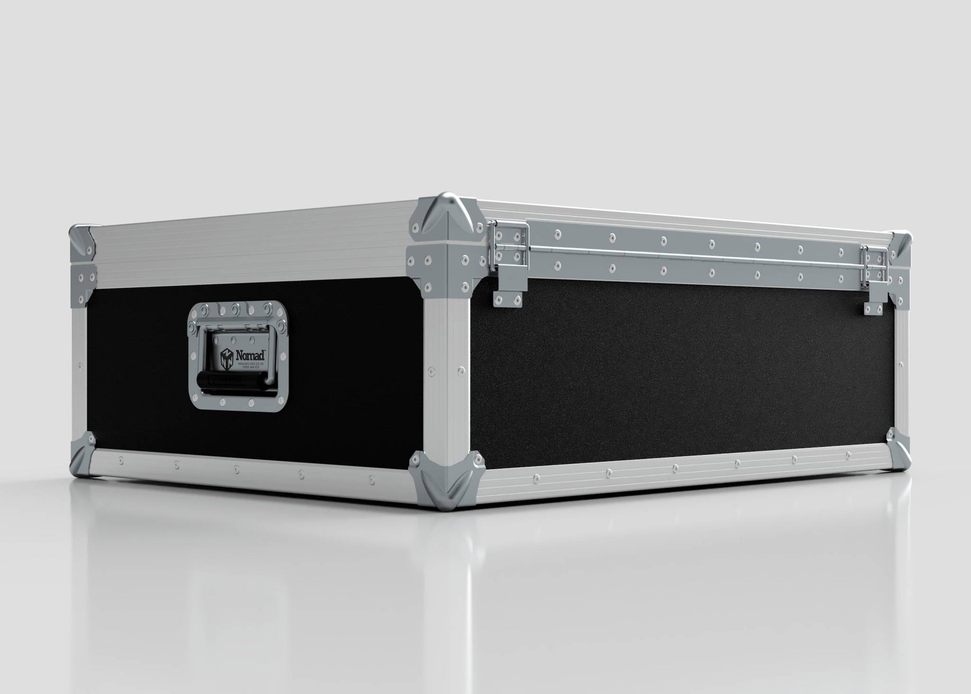 The 27" iMac Case, a large rectangular black and silver flight case with reinforced metal edges and corners, sits on a reflective white surface and features external dimensions of 745 x 600 x 273 mm.