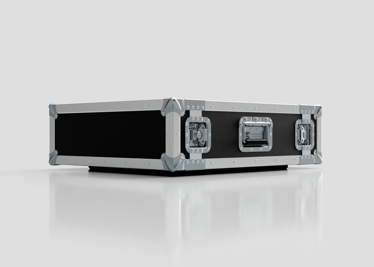 The 2U Suspended Shock Mounted Rack Case in black and silver features metal reinforced edges, corner protectors, and locking latches. Its shock mounted rack design provides extra impact protection while sitting on a reflective white surface.
