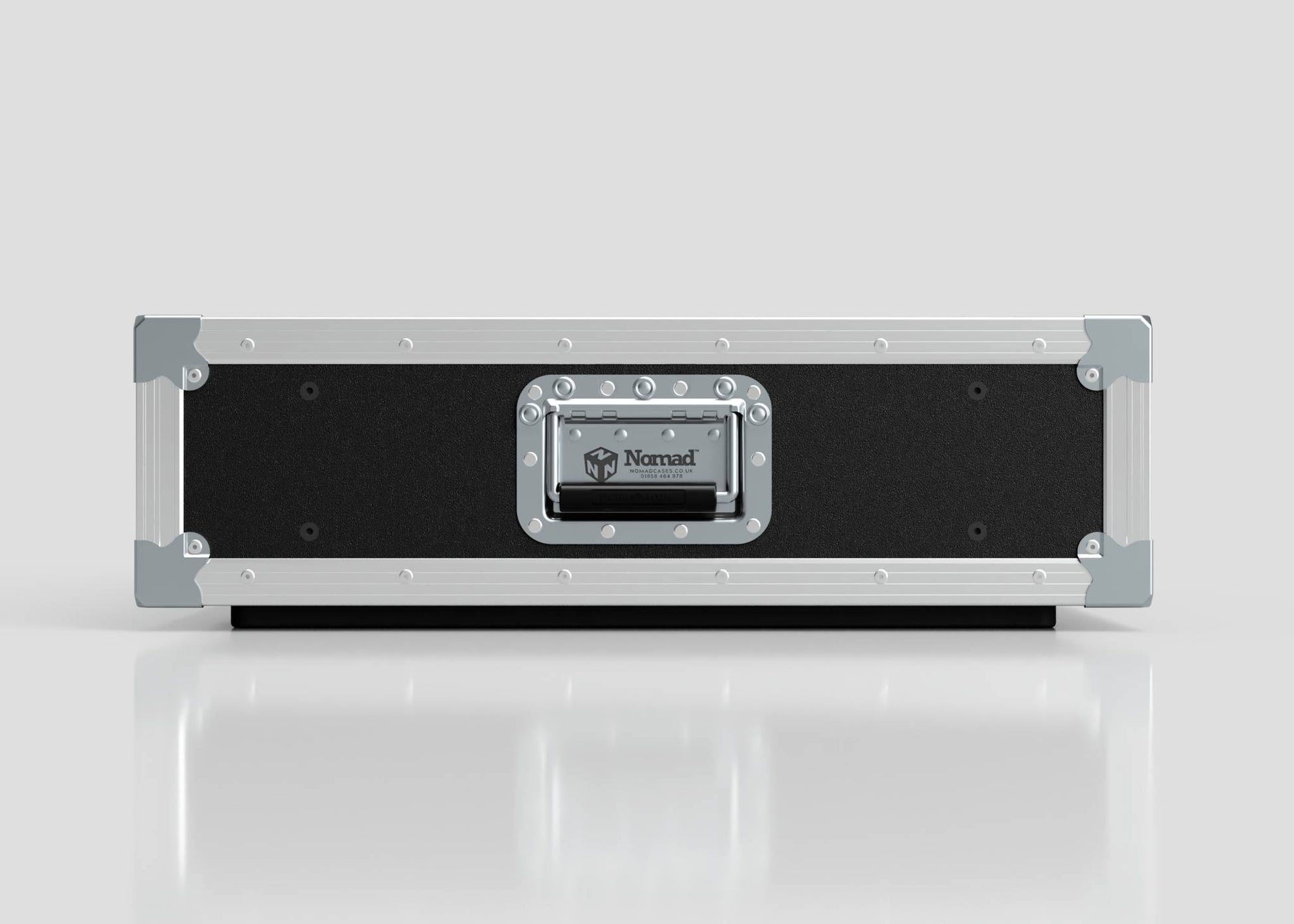 The 3U Slam Rack Case is a black and silver hard case with reinforced metal corners and a central handle featuring the Nomad logo, set on a reflective white surface; its external dimensions are 643 x 561 x 204 mm.