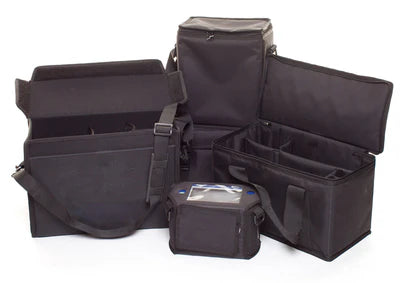 Four black soft-sided carrying cases of varying sizes and shapes are displayed against a white background.
