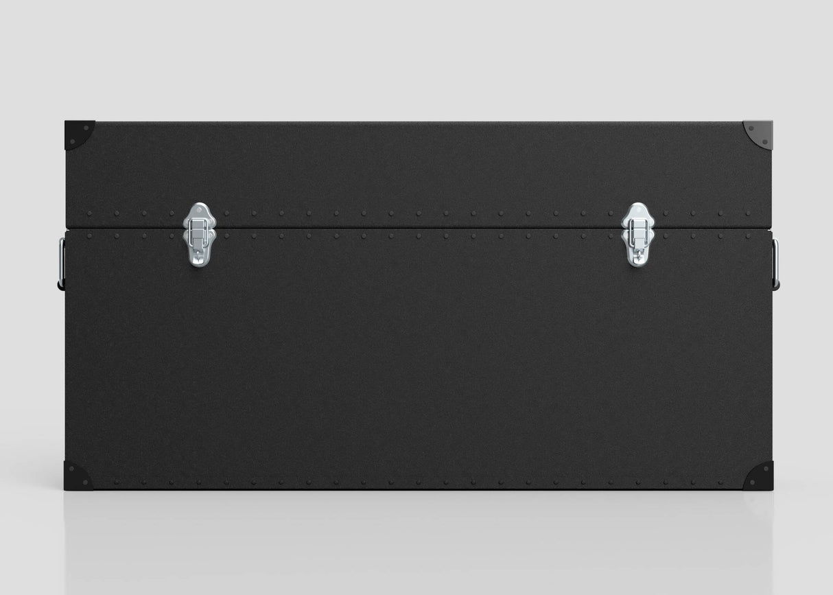 A 65" Single Screen Lite Guard™ Case, a lightweight black HDPE display transport trunk with silver latches, rivet accents, and reinforced corners, set against a plain light background.