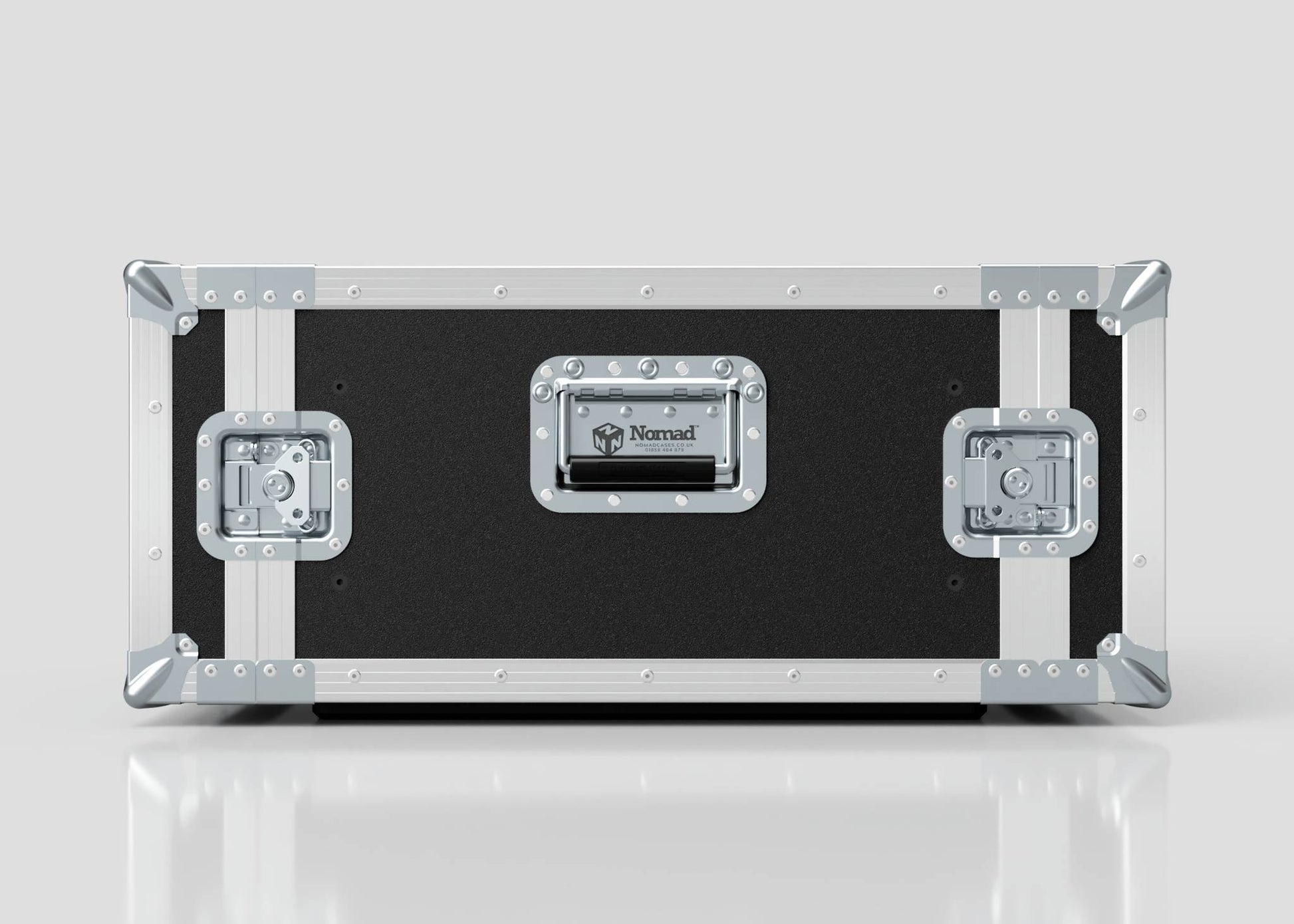 A 6U Standard Rack Case in black and silver with metal edges, corners, and latches, labeled Nomad on the handle plate and made in the UK, sits on a reflective surface.