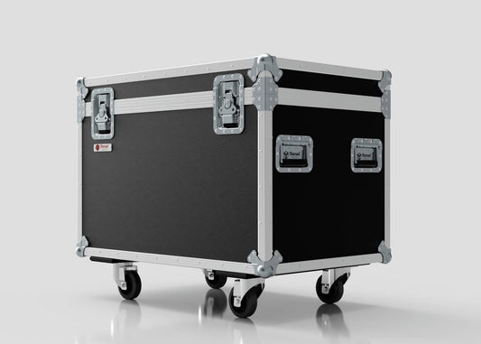 The 900mm Trunk Case is a large black and silver equipment case with metal reinforcements, handles, and four caster wheels. It stands against a plain light background and has external dimensions of 925 x 607 x 765 mm.