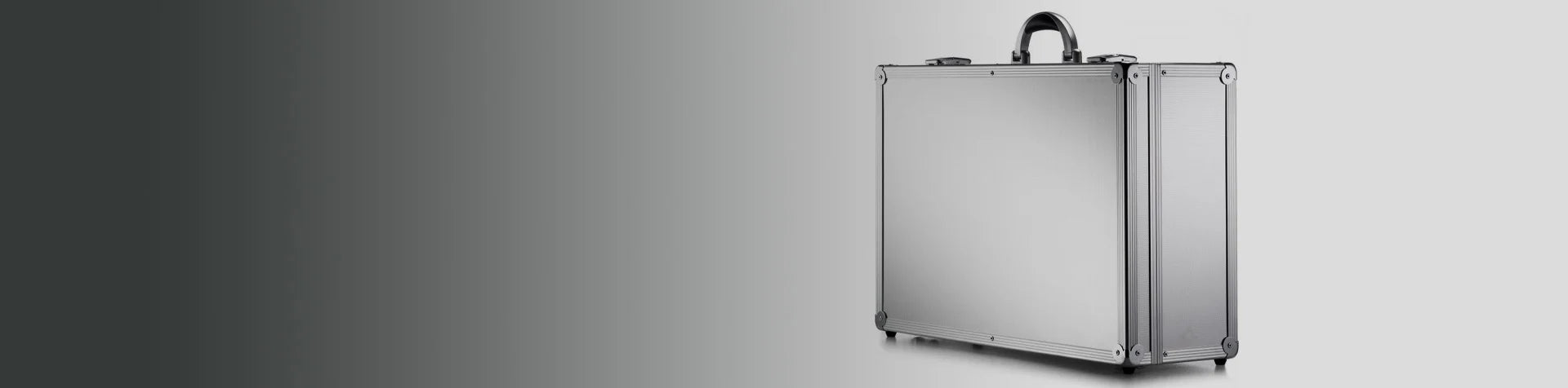 A silver metal briefcase with a black handle sits closed on a light gray background.