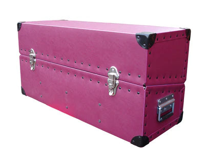A large, rectangular pink storage trunk with metal corner protectors, side handle, and two latch locks on the front.