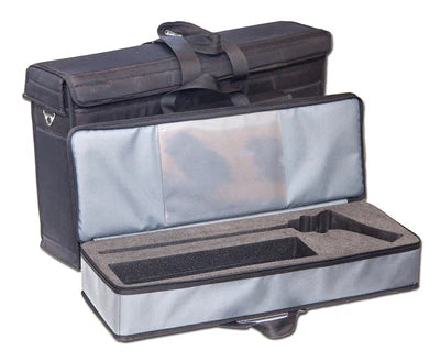 A black and gray padded carrying case with a handle, shown open to reveal custom foam compartments for equipment or tools. Another closed case is positioned behind it.