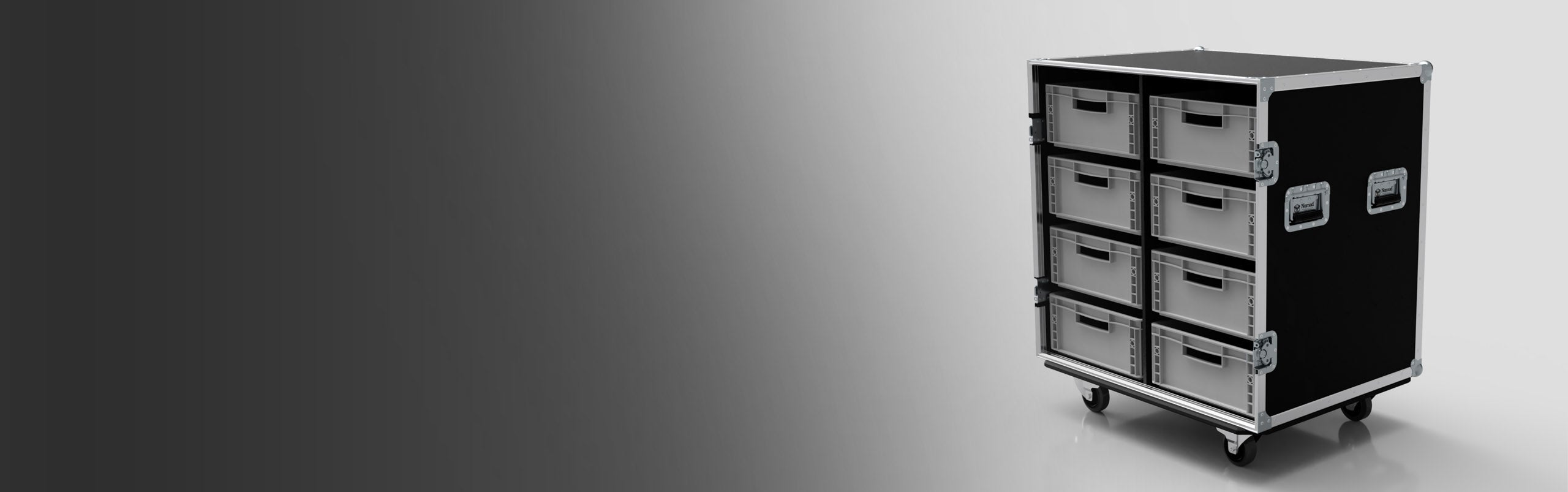 A black rolling storage case with eight metal drawers and side handles, placed on a light surface with a gradient gray background.