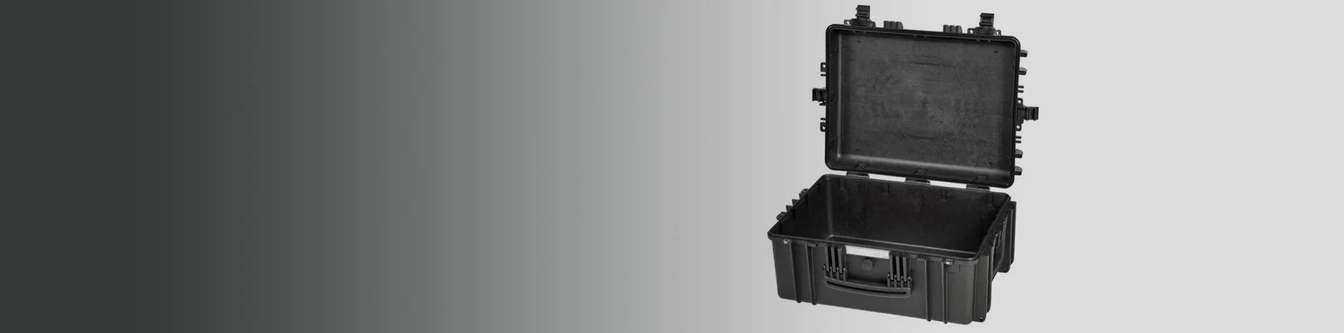 A black hard plastic protective case with an open lid, shown against a gradient grey background.