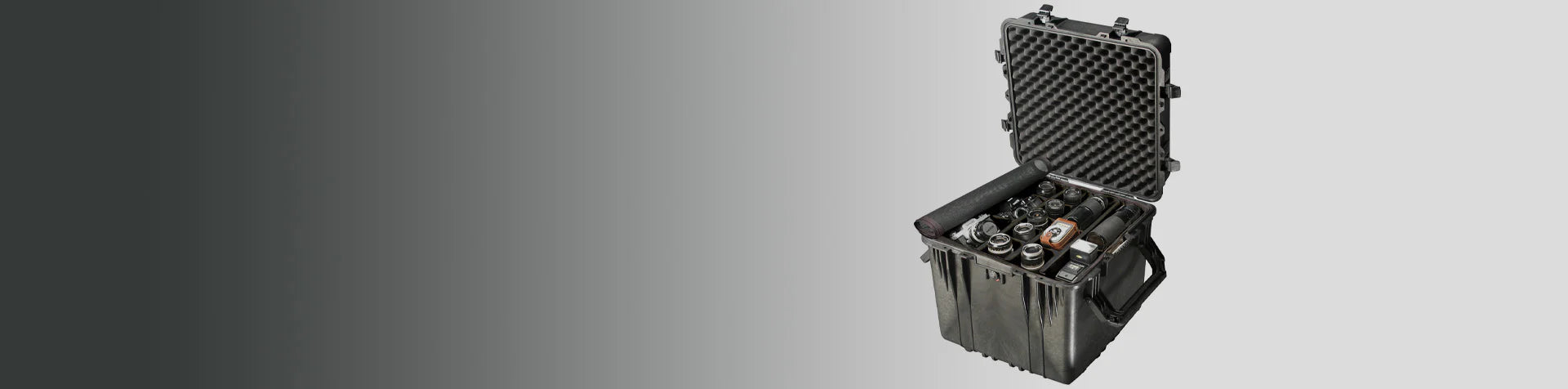 A hard protective case with foam lining is open, revealing multiple camera lenses and equipment inside, placed against a gradient gray background.