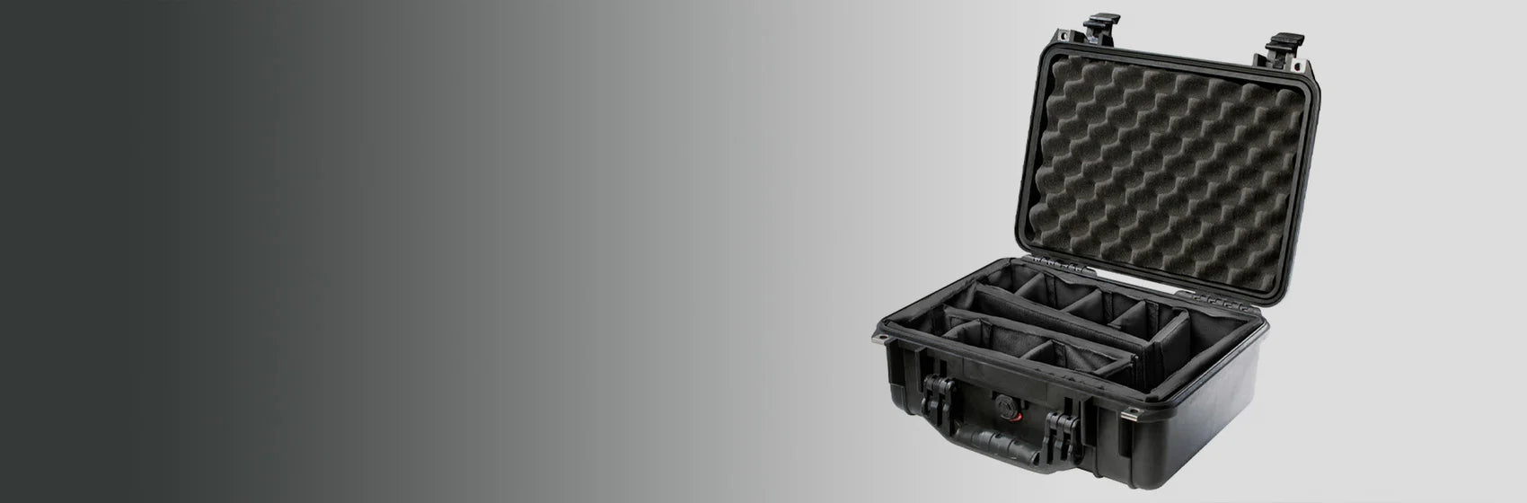 A black hard-shell protective case with foam padding and compartments is open on a gray gradient background.