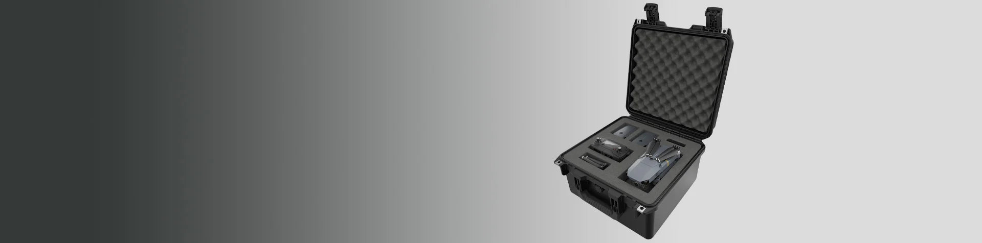 A hard protective case with foam inserts holds a drone, remote control, and accessories, displayed on a gradient grey background.
