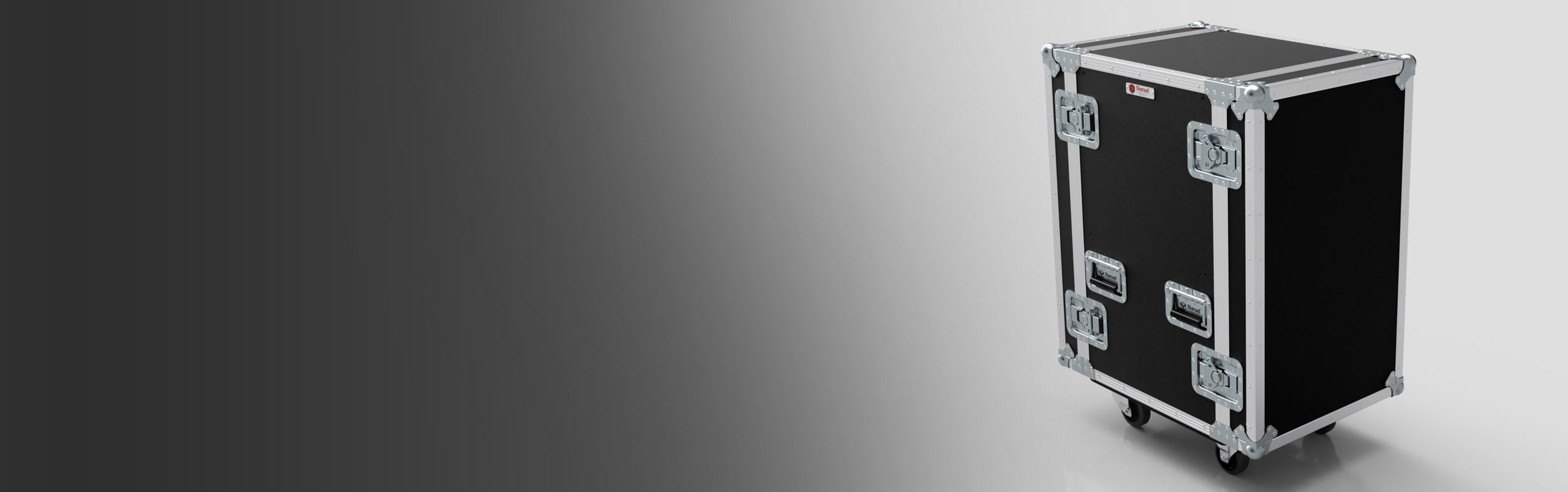 A large, black rolling equipment case with metal edges and handles is positioned on a gradient background.