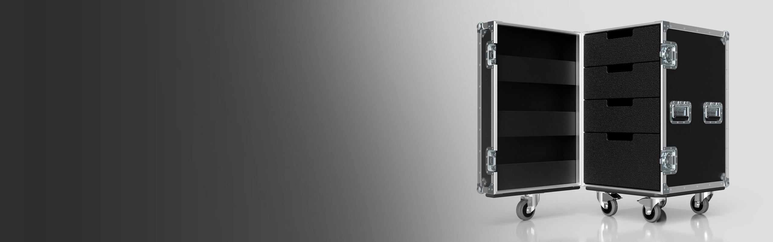 A black road case on wheels with metal edges and handles, shown open to reveal shelves and drawers, against a gradient gray background.