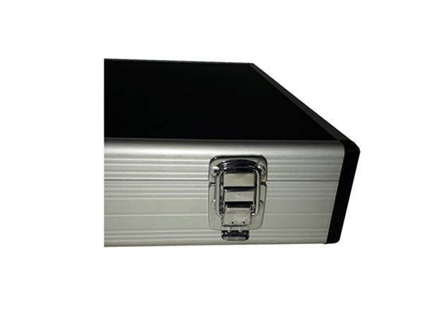 Close-up of a metal latch on the corner of the Aluminium Print Portfolio, a rectangular case finished in silver and black.