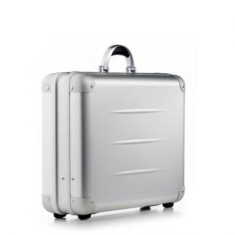 The ALUpur 98300, a silver anodised aluminium case with a curved handle and sturdy metal hinges, stands upright on a white background.