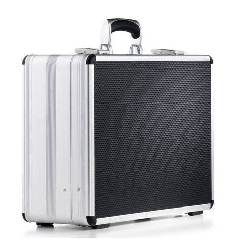 The AZKE 95600 is a silver and black aluminium frame case with a handle, shown closed and standing upright on a white background, providing both durability and style.