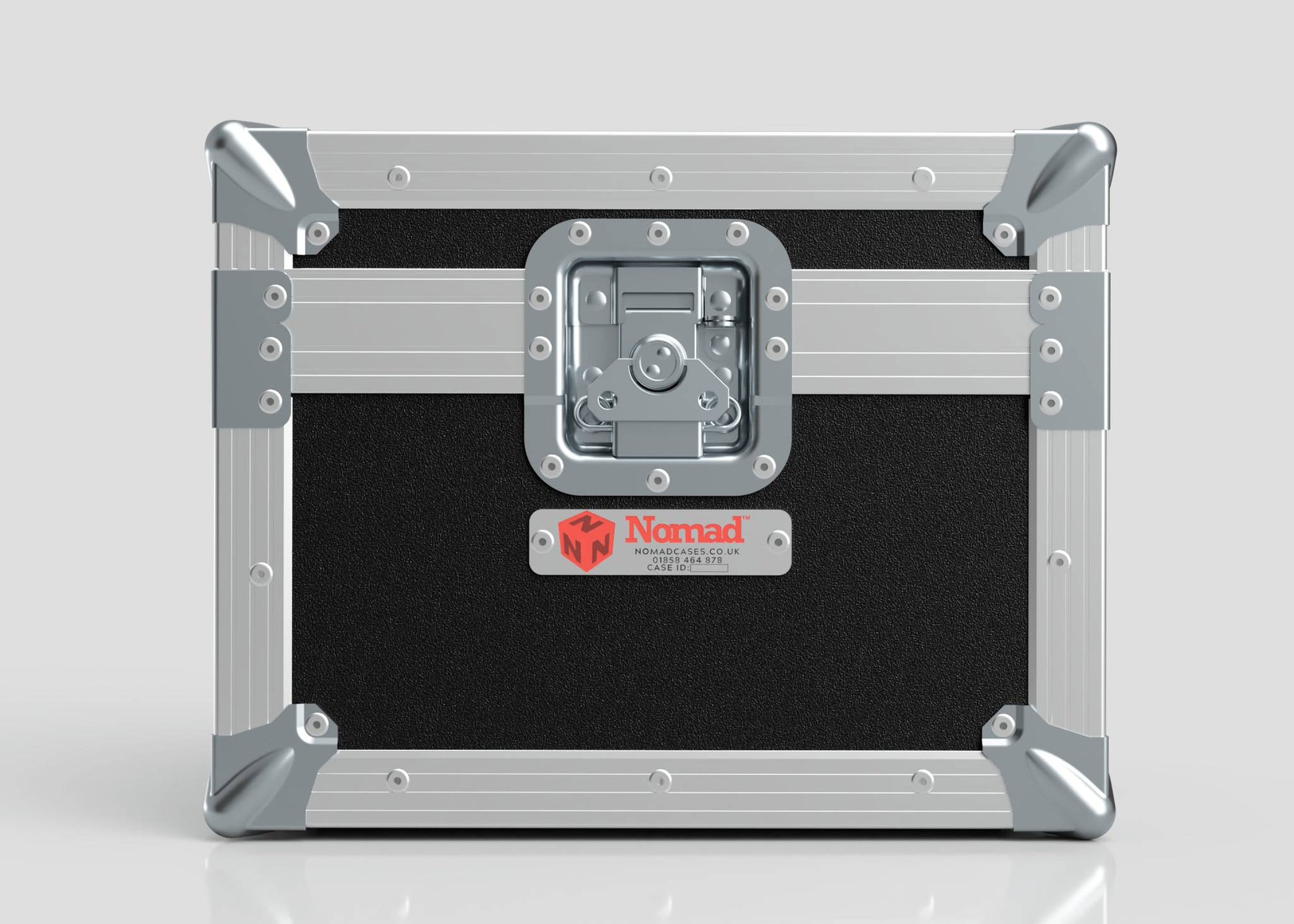 Black and silver Camera Lens Case with reinforced metal corners, a central latch, and a red Nomad label on the front.