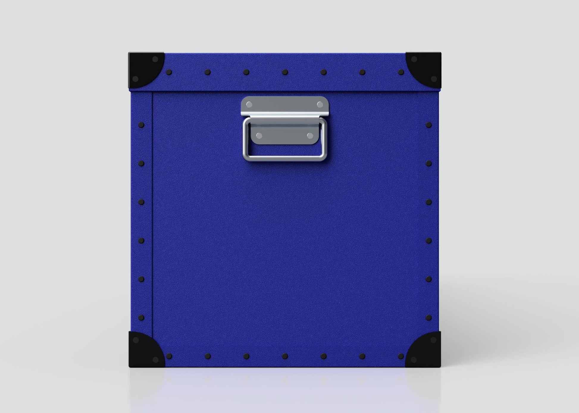 The Cricket Storage Poly Case (Large) is a square blue polyethylene box with black corner protectors, metal studs, and a zinc drop handle on the front, shown against a plain white background.