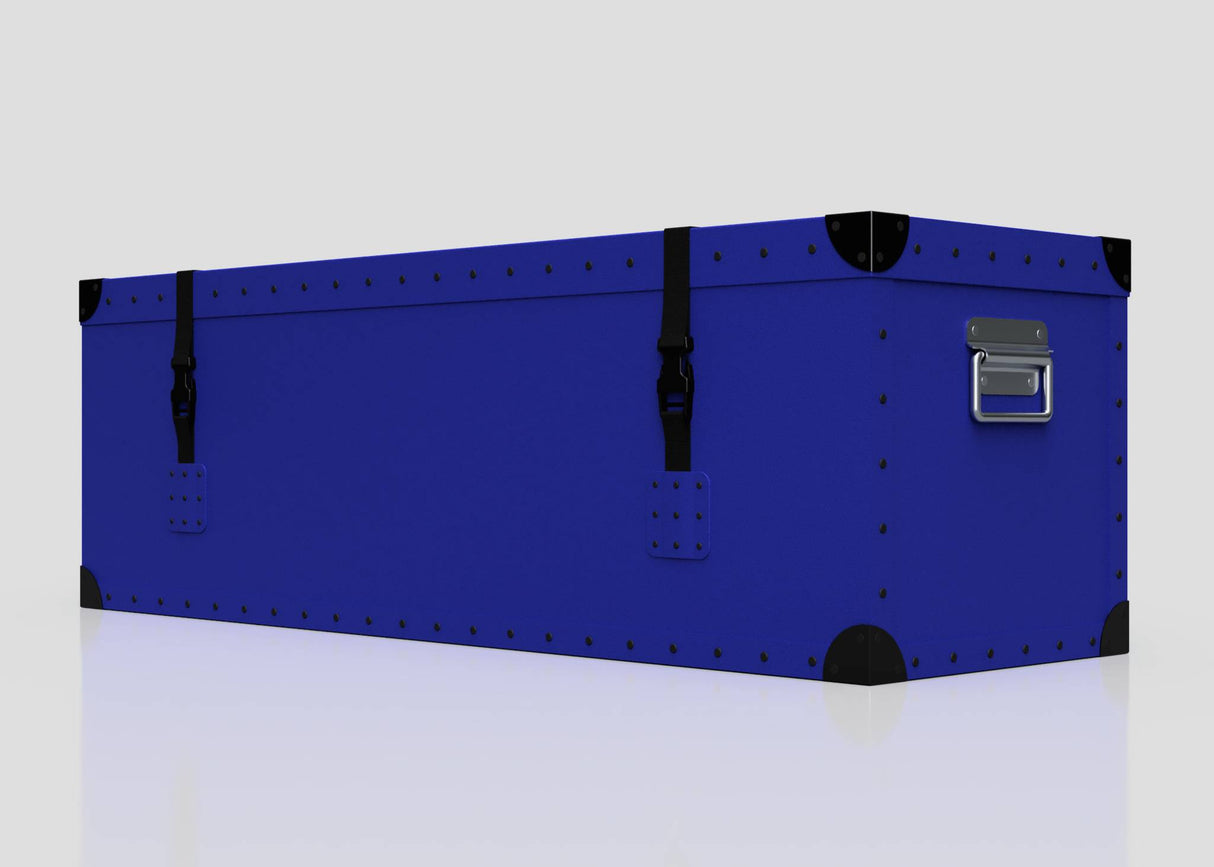 The Cricket Storage Poly Case (Medium) is a blue rectangular polyethylene box featuring black corner protectors, zinc drop handles, and two black webbing straps, displayed against a plain white background.