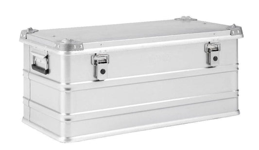 The Defender KA74-009 is a rectangular silver metal storage box with side handles, two front latches, an 81-litre capacity, and a custom routed foam interior, shown against a plain white background.