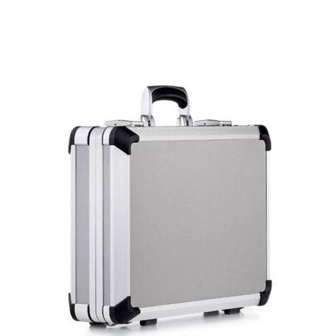 The Exclusive 93700 is a silver aluminium frame case with black corner protectors and a handle, standing upright on a white background and featuring custom CNC foam fittings for superior protection.