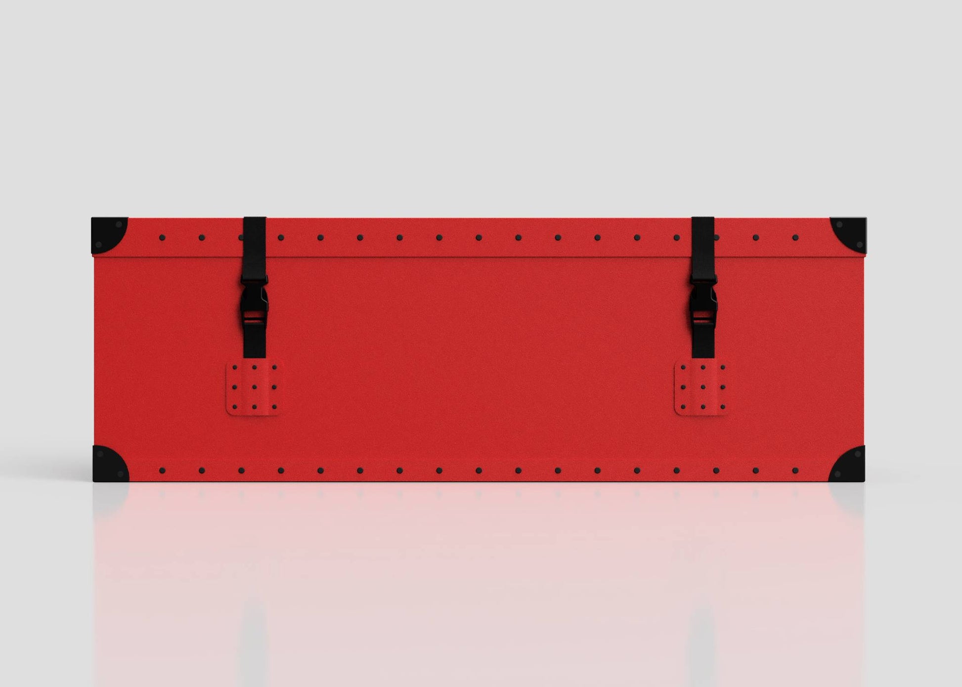 The Football Storage Poly Case (Small) is a rectangular red polyethylene box with black corner protectors, riveted edges, a zinc drop handle, and two black buckle straps on the front, shown against a plain light background.