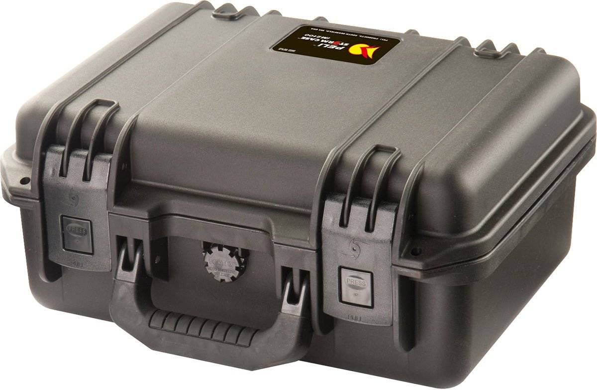 The iM2100 Storm Case is a closed, hard-shell black case with a handle and dual latches, plus a small label on top. This crushproof PELI case ensures reliable protection for your gear.