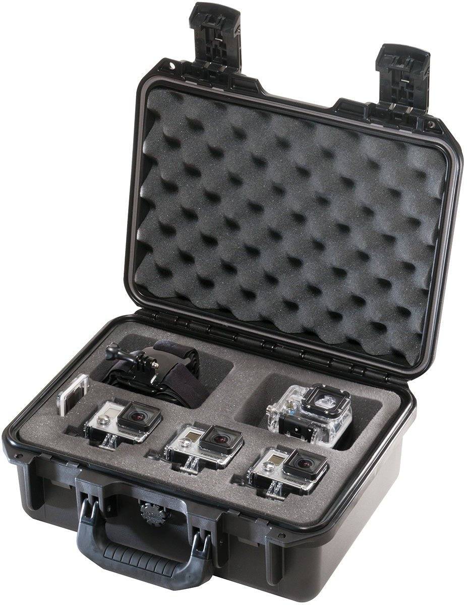 An iM2100 Storm Case with custom foam compartments securely holds four action cameras and a mounting accessory. The watertight case is open, displaying the neatly organized equipment inside.