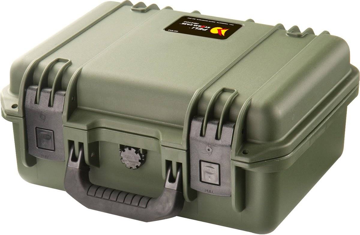 A closed, hard-shell olive green iM2100 Storm Case with a black handle, two latches, and a rectangular label on top; this watertight case offers superior protection.