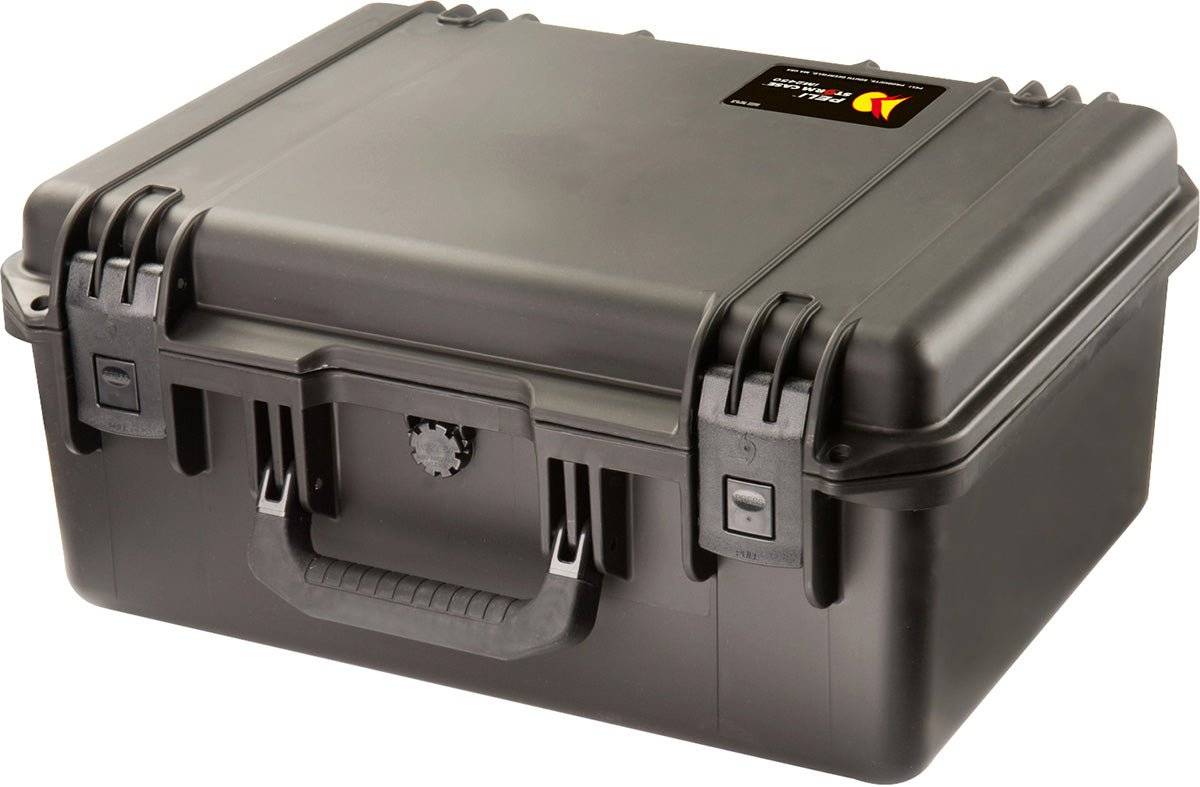 The iM2450 Storm Case is a closed, hard plastic black case with a handle, secure latches, and a small top-corner label. This crushproof PELI case provides durable protection for your valuables.