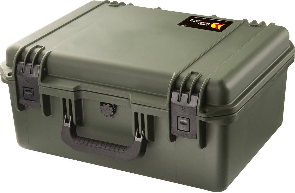 The iM2450 Storm Case is a sturdy, olive green PELI case with a black handle, dual latches, and a small label on the lid's upper right corner—offering crushproof protection for your gear.