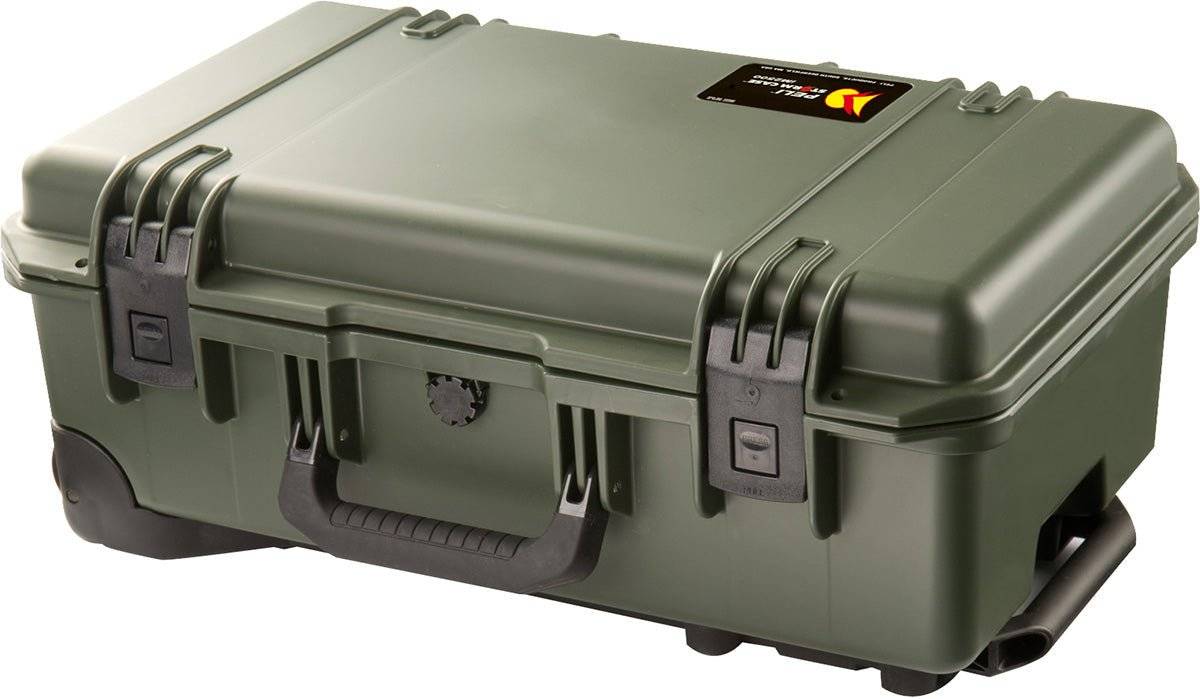A closed, green iM2500 Storm Carry-On Case with black latches, handle, and a small ID label on the top right offers crushproof protection for your gear.