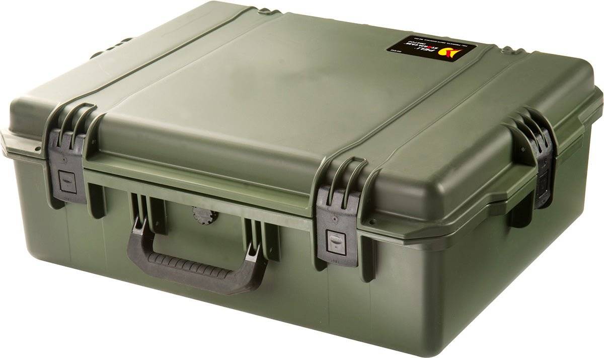 A closed, olive green iM2700 Storm Case with black latches, a handle, and a small label on the top right corner. This watertight case keeps your gear safe and protected.