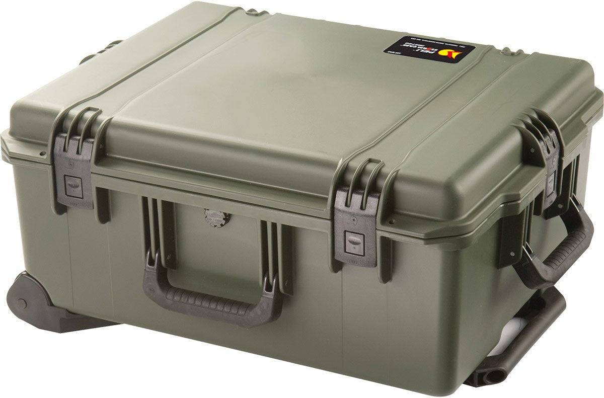 The iM2720 Storm Travel Case, shown in green with custom CNC foam, has a side handle, black wheeled base, and secure Press and Pull latches, all displayed on a white background.