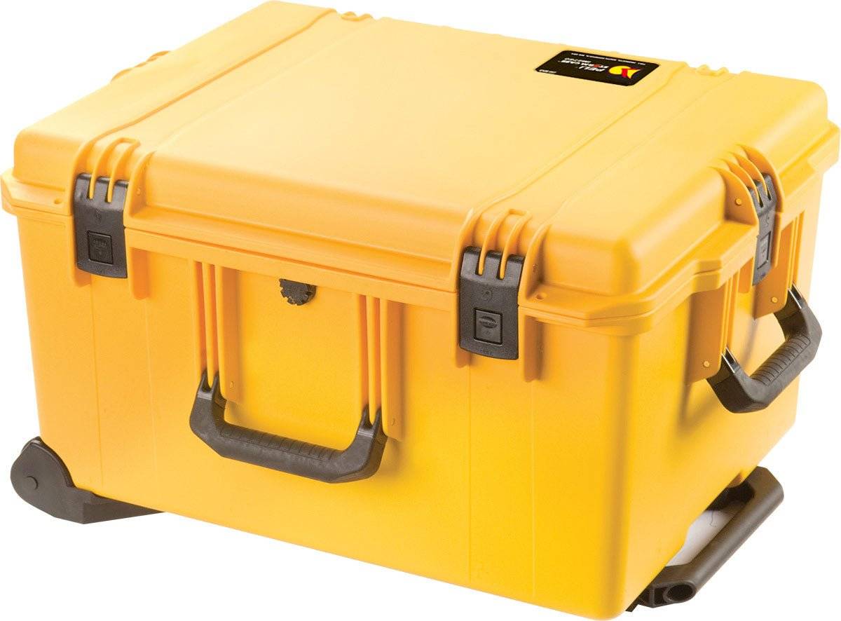 The iM2750 Storm Travel Case is a sturdy yellow PELI case with black latches, handle, wheels, and custom foam, designed for safe equipment transport and storage.