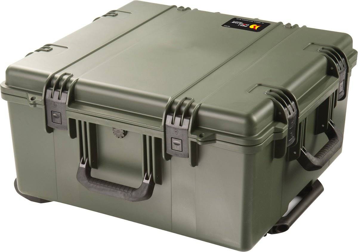 An olive green iM2875 Storm Travel Case with custom CNC foam, reinforced corners, black handles, and Press and Pull latches rests on a white background.
