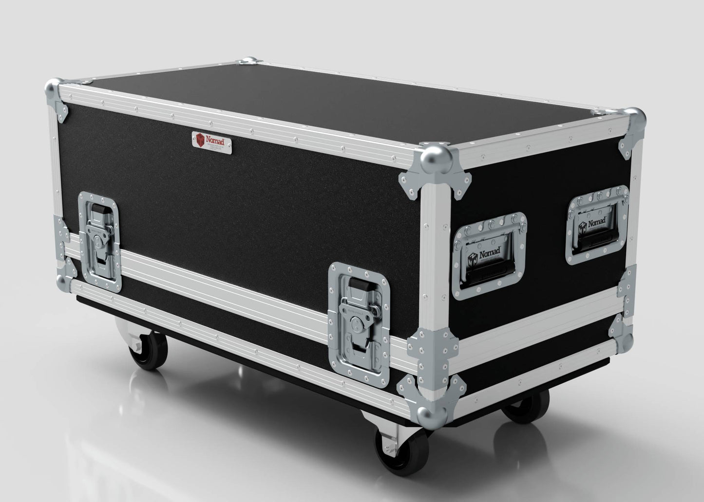 The Medium Gearbox Case is a black rectangular storage box with metal reinforcements, handles, latches, and four caster wheels. Its internal dimensions are 940 x 450 x 400 mm. Shown here on a white surface.