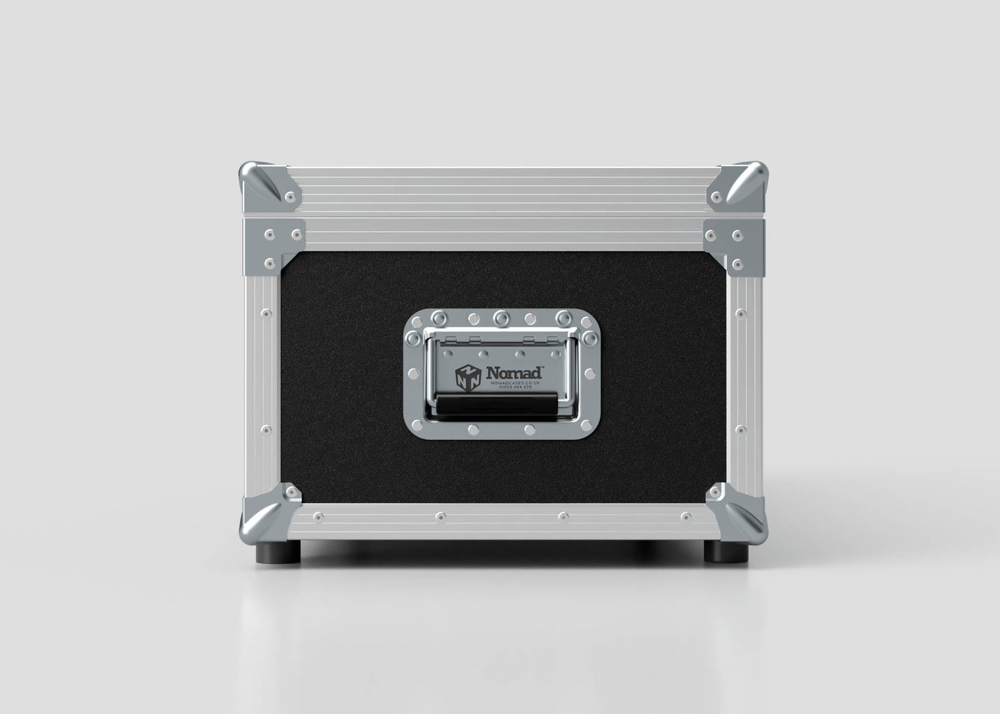 A black and silver Lid Maker Trunk Case with metal corners, a handle, and a Nomad label on the front sits on a plain white surface. Its external dimensions are 1010 x 400 x 410 mm.