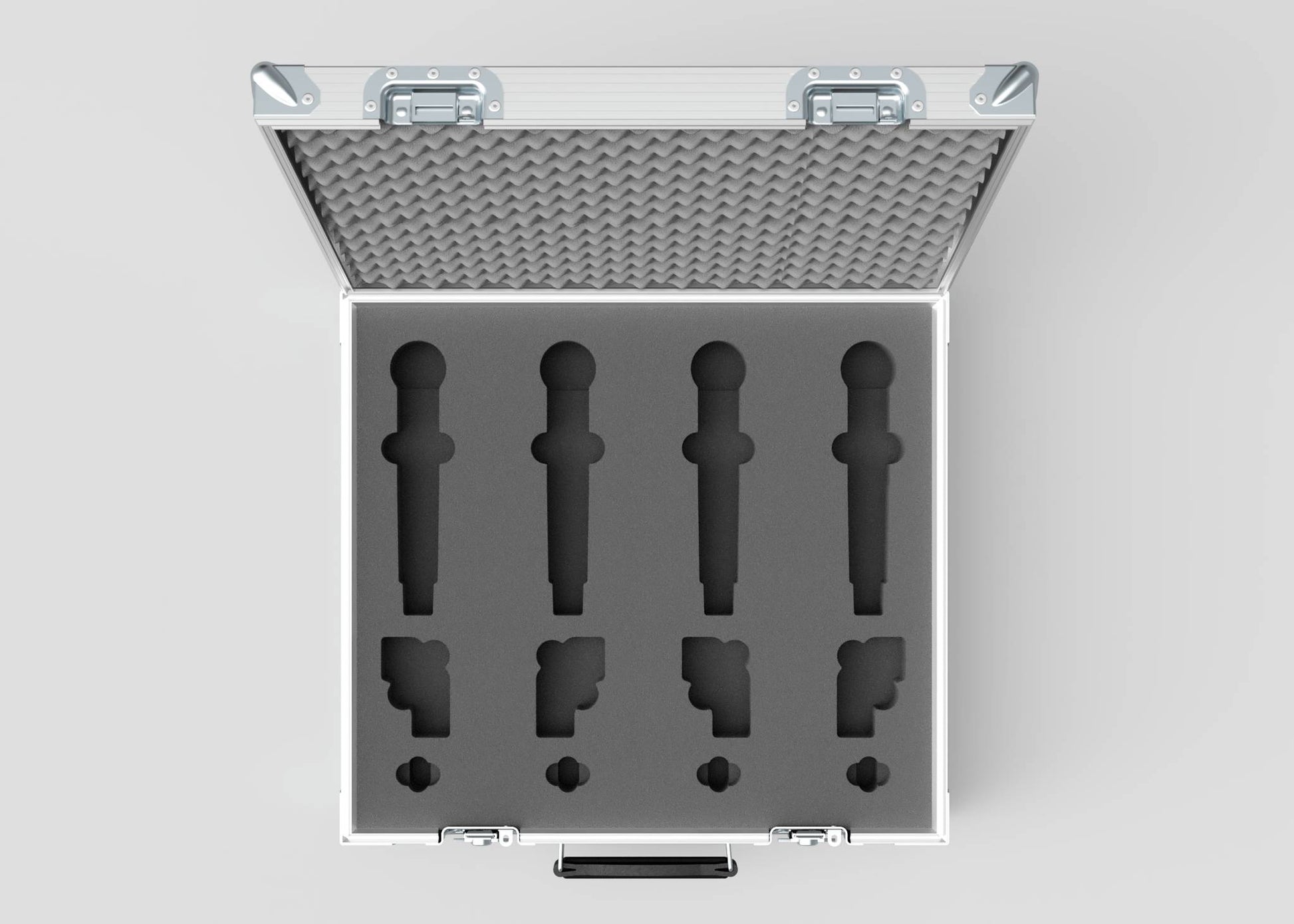 The Microphone Case is an open silver case with foam cutouts for four microphones and accessories, seen from above. External dimensions are 577 x 526 x 192 mm, providing secure organization and easy transport.